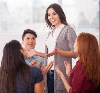 I have an issue. Group of people sitting close to each other while man telling something and gesturing